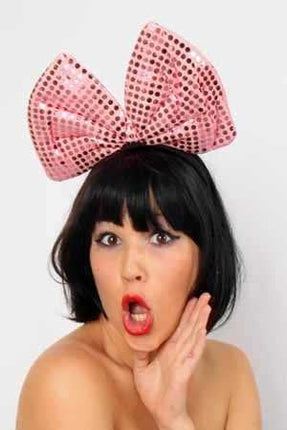 Haarbeugel met pailettenstrik roze